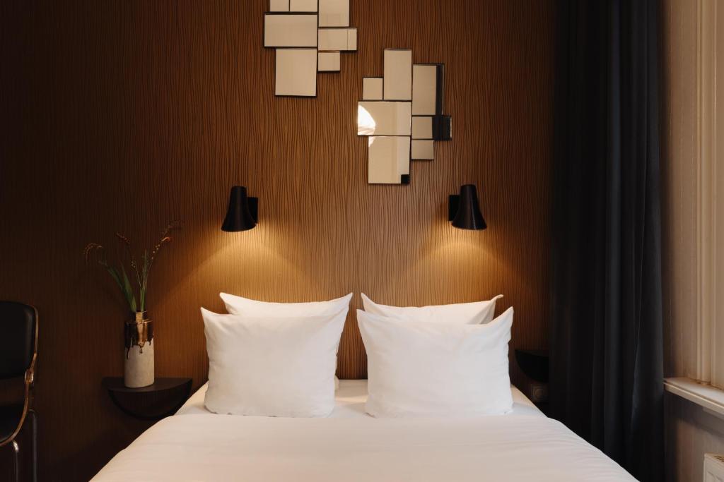 Postel nebo postele na pokoji v ubytování Hotel V Frederiksplein