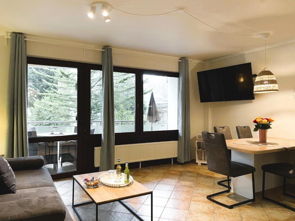 a living room with a couch and a table at Fischerhuus Whg 3 in Wyk auf Föhr