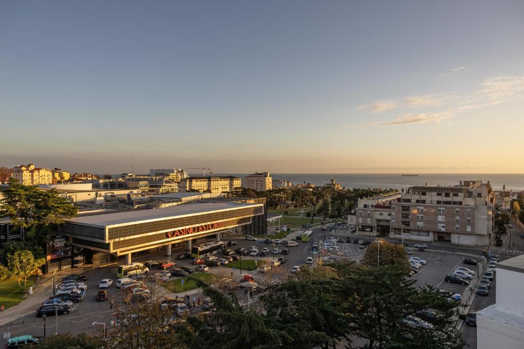 an overhead view of a city with a parking lot at Hotel Alvorada in Estoril