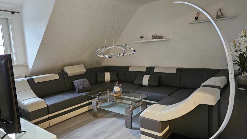 a living room with a couch and a table at Haus Ilse Wohnung 9 in Sankt Andreasberg