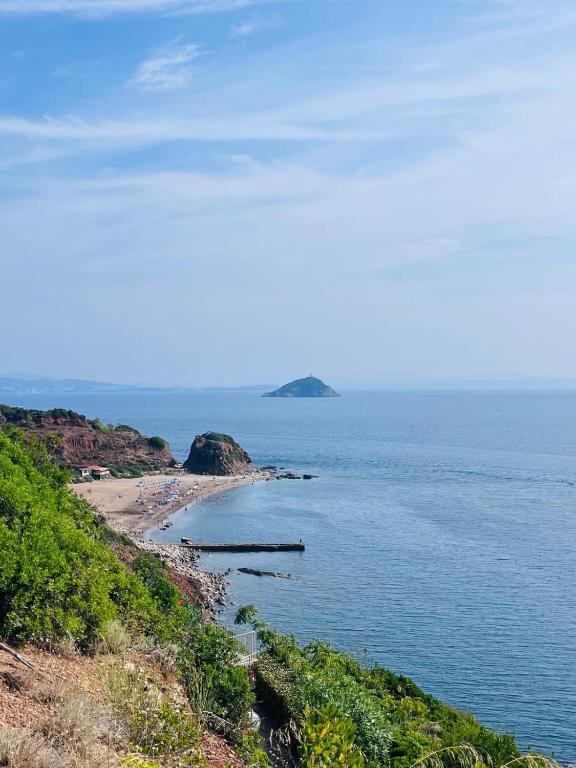 a view of a beach and the ocean at Casa Solana al Cavo - Elba Affitti in Cavo