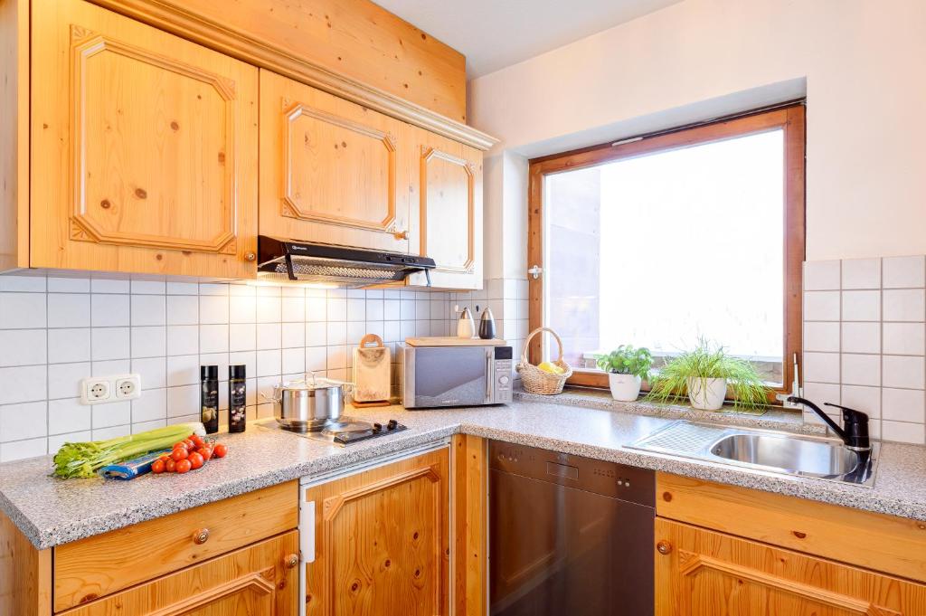 Kuchyň nebo kuchyňský kout v ubytování Haus Alpenecho