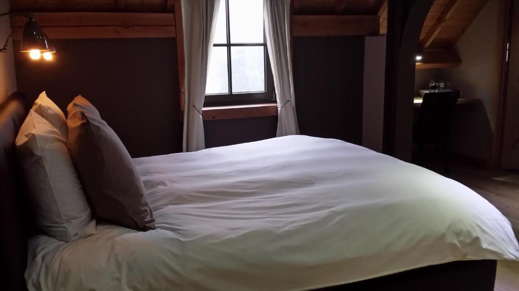 Postel nebo postele na pokoji v ubytování B&B Le Briquemont