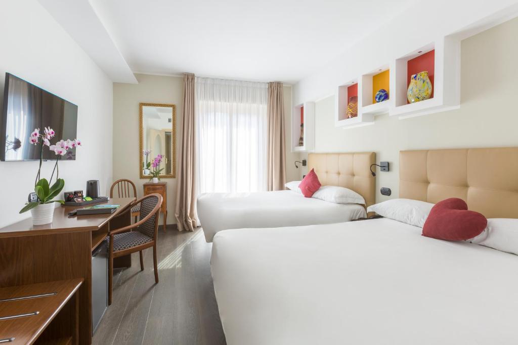 Postel nebo postele na pokoji v ubytování Hotel Central Wellness
