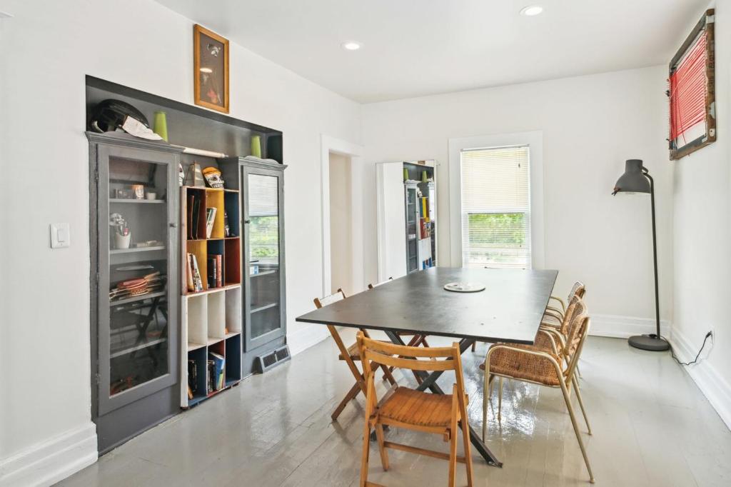 a dining room with a table and chairs at 4BR Gem in Detroit North End Downtown Nearby in Detroit