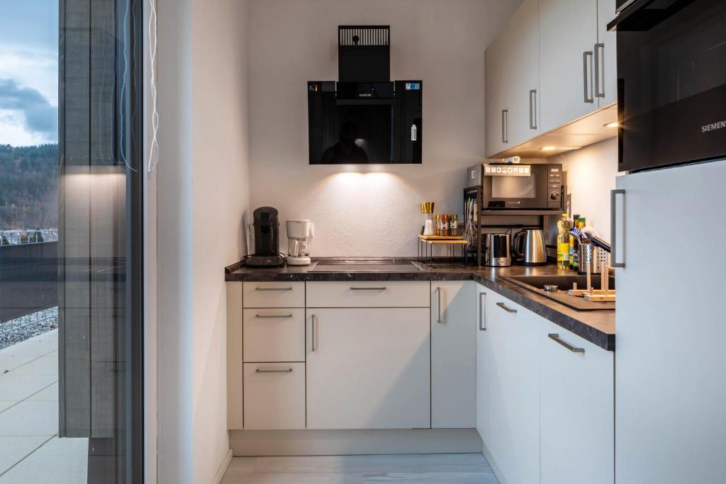 Kuchyň nebo kuchyňský kout v ubytování Felsenkeller Appartements