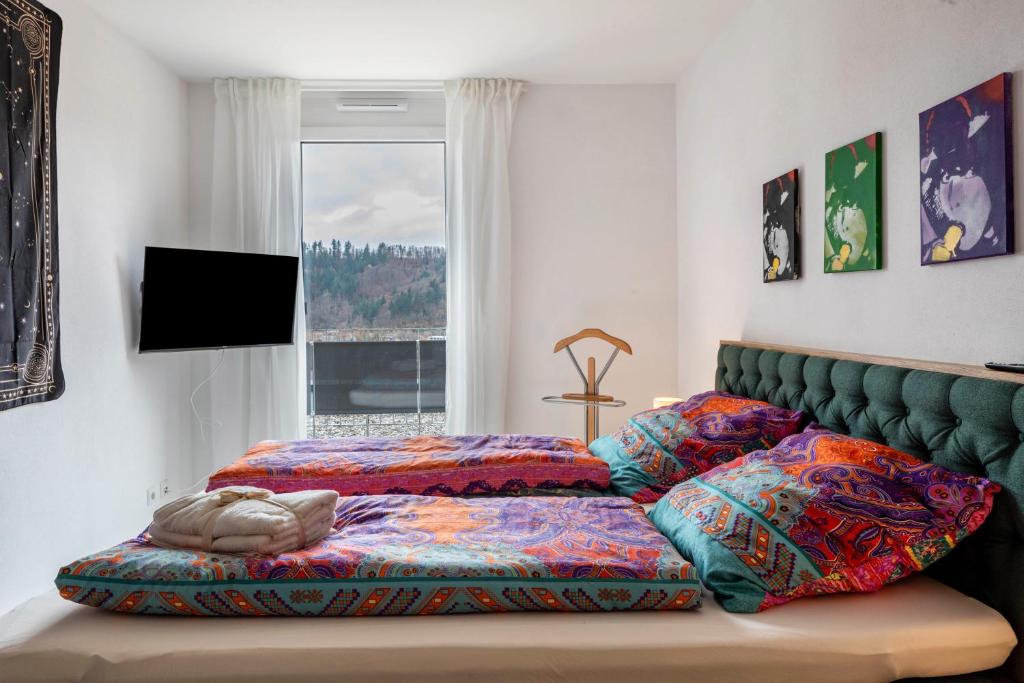 Postel nebo postele na pokoji v ubytování Felsenkeller Appartements