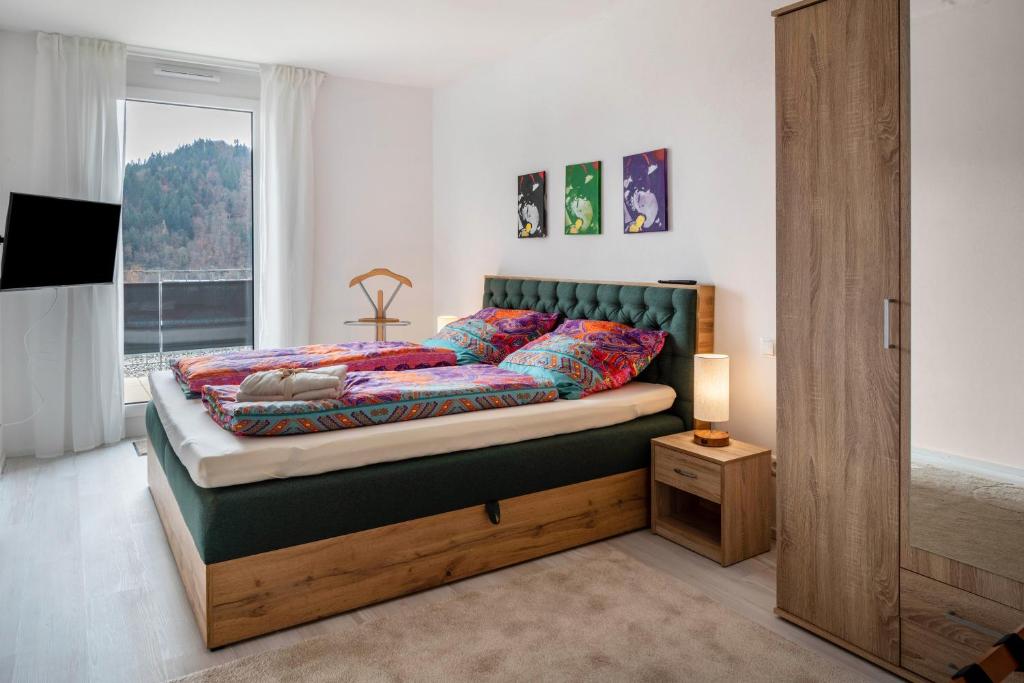 Postel nebo postele na pokoji v ubytování Felsenkeller Appartements