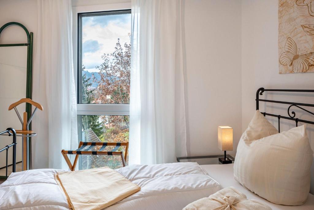 Postel nebo postele na pokoji v ubytování Felsenkeller Appartements