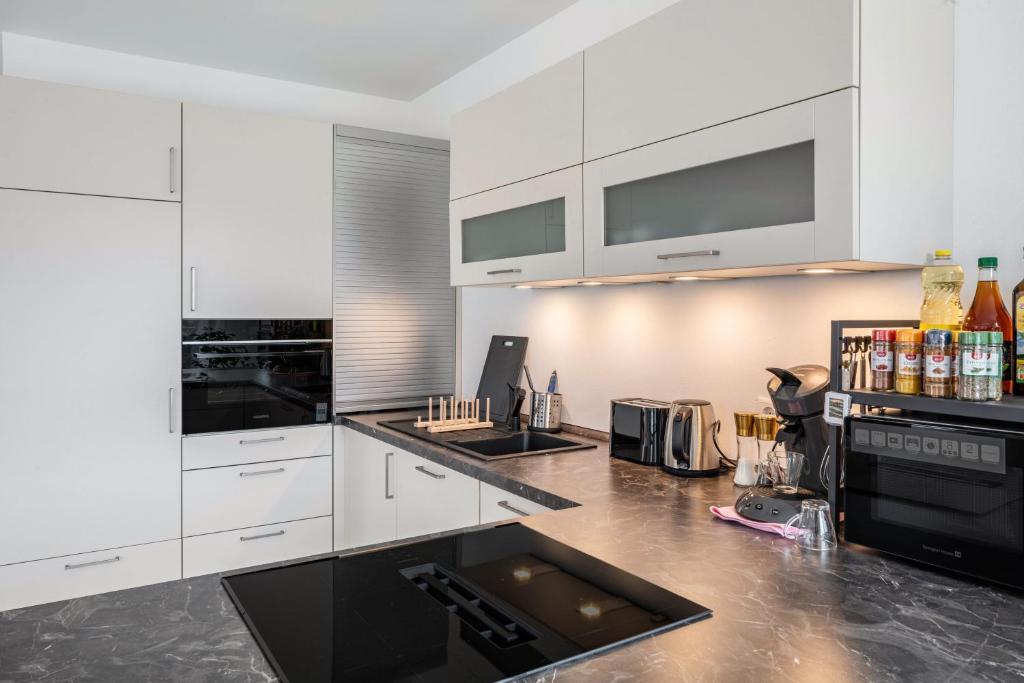 Kuchyň nebo kuchyňský kout v ubytování Felsenkeller Appartements