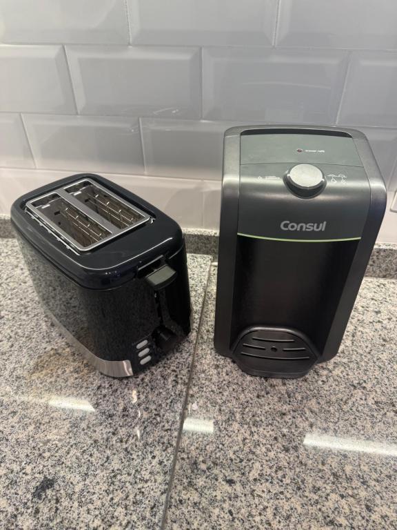 a toaster sitting on top of a counter at Studio Campo Belo 301 in Sao Paulo