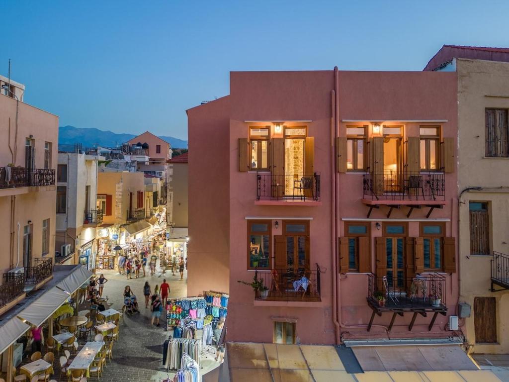 a view of a street in a city with people walking at Leo Apartment 2 bdr apt overlooking the harbor in Chania