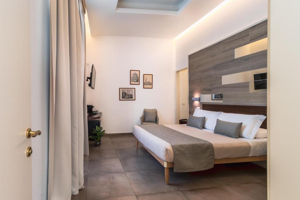 Postel nebo postele na pokoji v ubytování Palazzo San Lazzaro - Jacuzzi Rooms & Suites Lecce Selection
