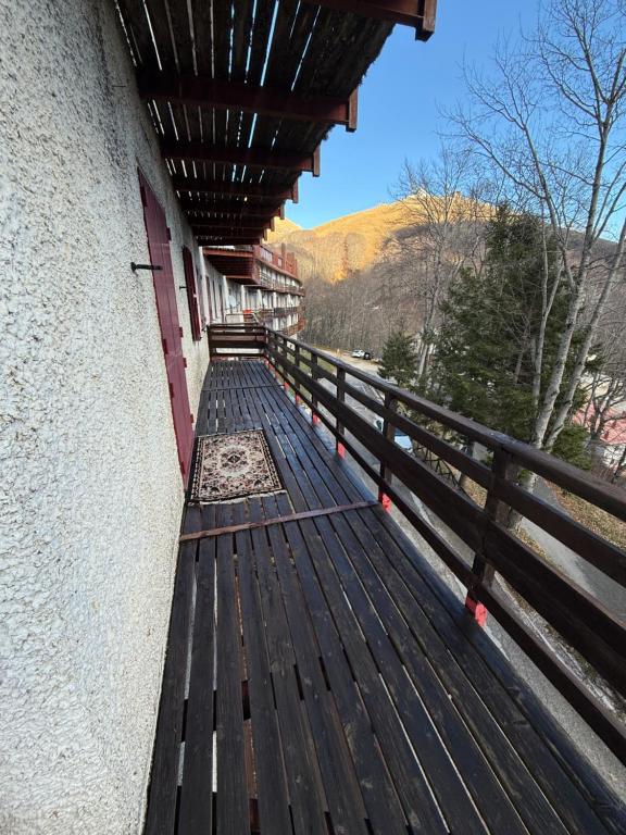 a wooden bench sitting on the side of a building at Home Beta in Terminillo
