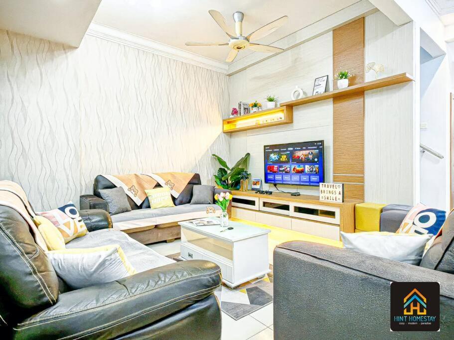 a living room with couches and a flat screen tv at Pool,TVBox,Landed,5 min Aeon,Bukit Indah,Legoland in Johor Bahru