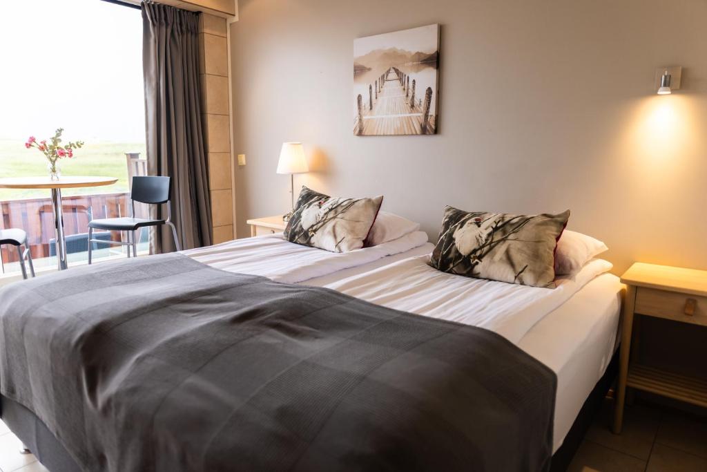 Postel nebo postele na pokoji v ubytování Hotel Laxarbakki