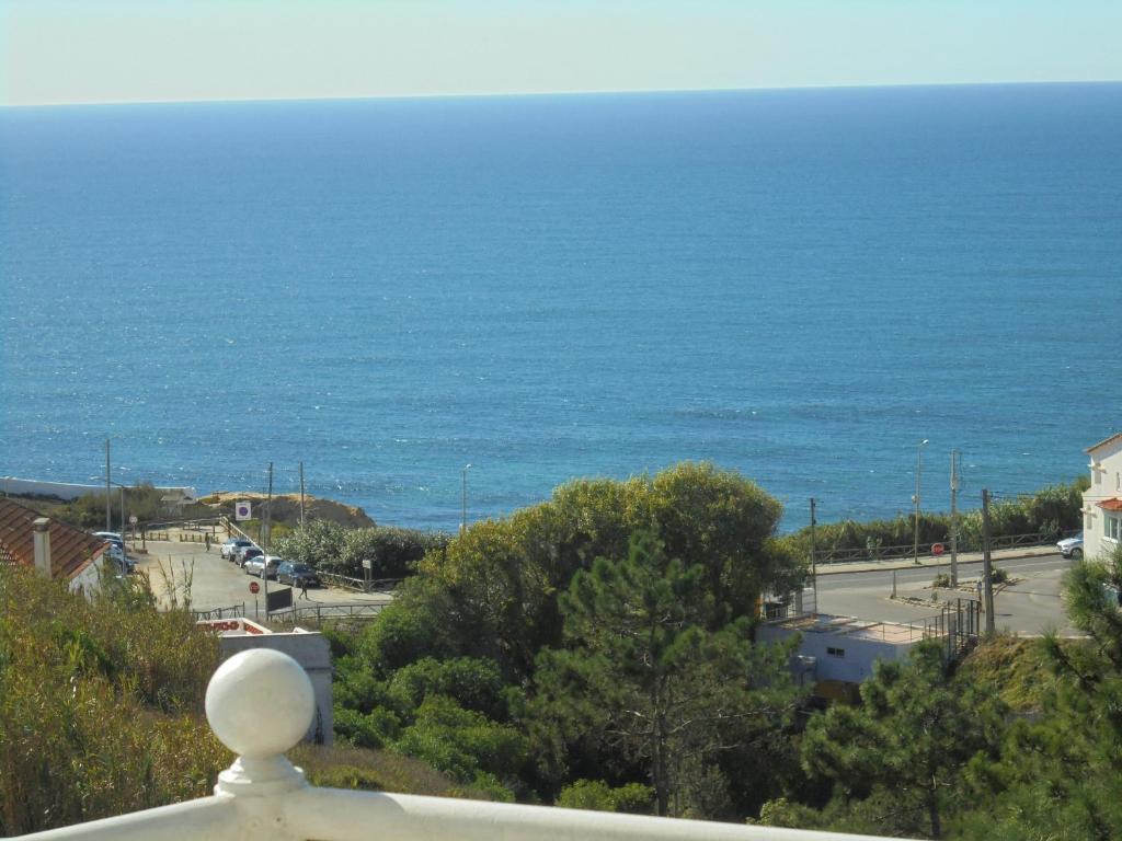 a view of the ocean from a balcony at Ericeira Sunset Apartment in Ericeira