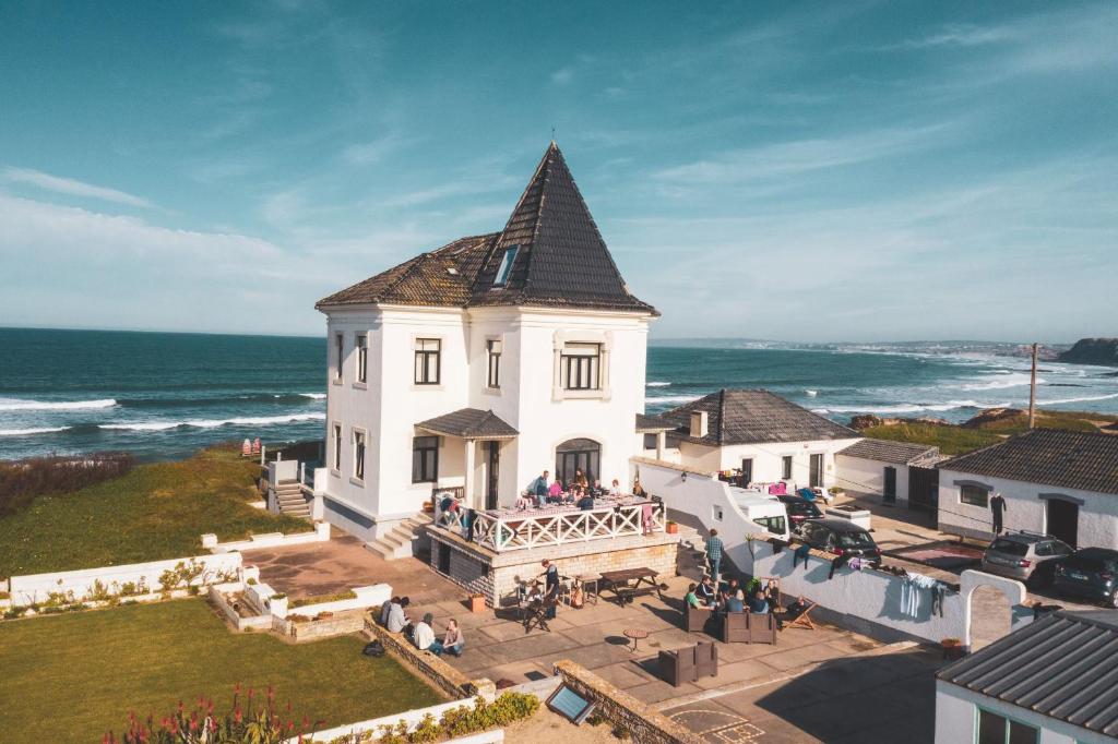 an aerial view of a building with the ocean in the background at Surfcastle bnb and Surf School in Ferrel