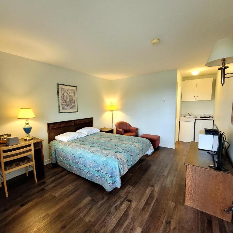 Postel nebo postele na pokoji v ubytování Ridgeview Motor Inn