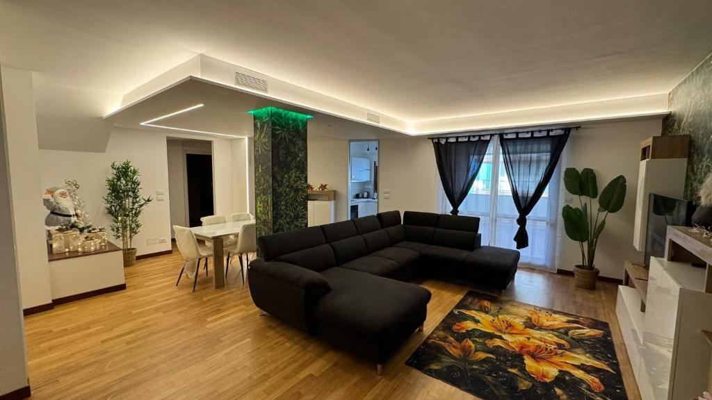 a living room with a couch and a table at 085 luxury apartment in Montesilvano