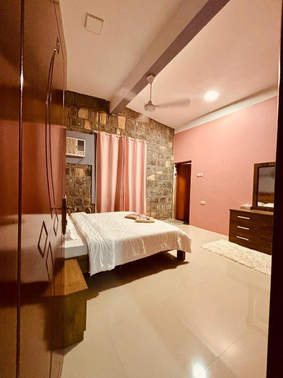 Postel nebo postele na pokoji v ubytování Jabal Shams Villa
