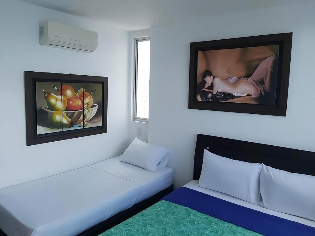 En eller flere senge i et værelse på Lodging Apartamento 31 Frente a la Playa