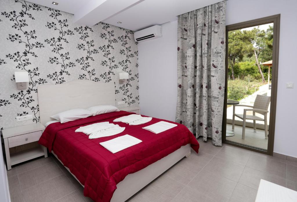 Postel nebo postele na pokoji v ubytování Hotel Akti
