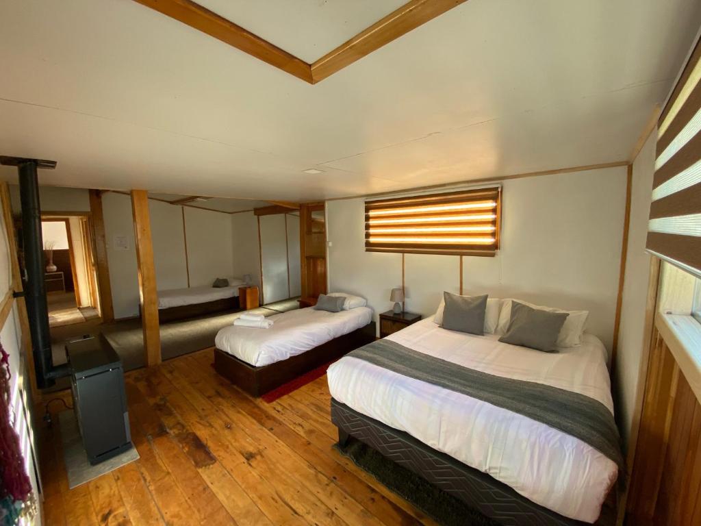 Postel nebo postele na pokoji v ubytování Hostal Amerindia