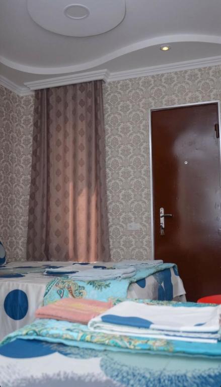 Postel nebo postele na pokoji v ubytování Kutaisi Best Guesthouse