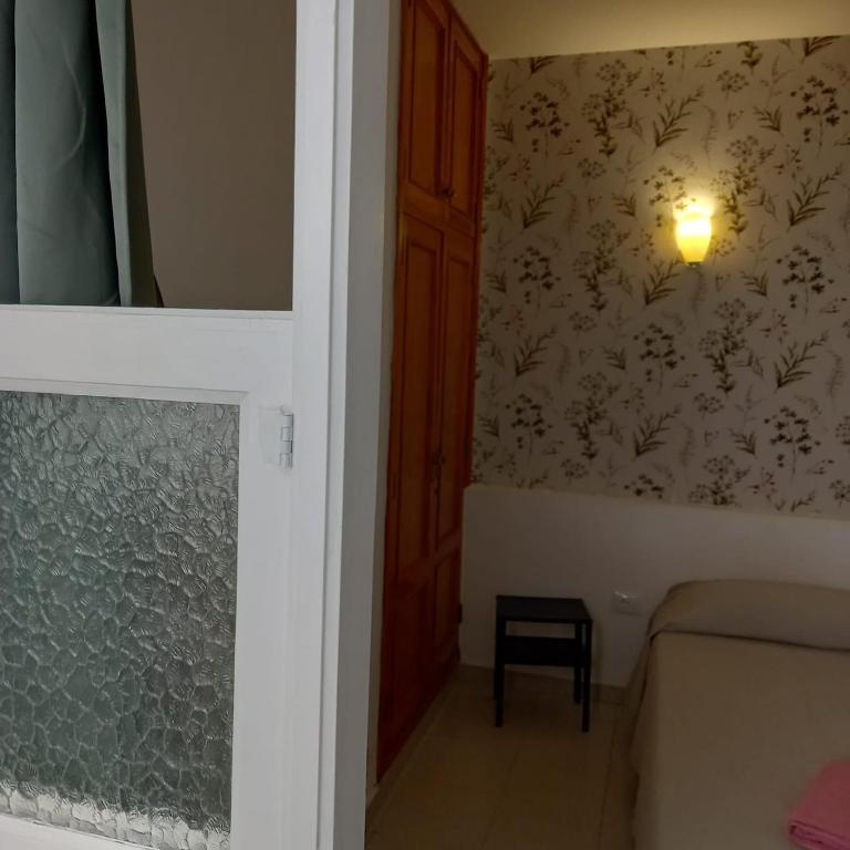 Postel nebo postele na pokoji v ubytování Pensión Casablanca