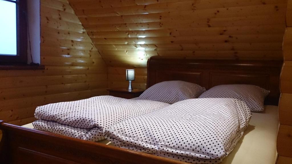 Ein Bett oder Betten in einem Zimmer der Unterkunft Dom Wakacyjny Letnisko