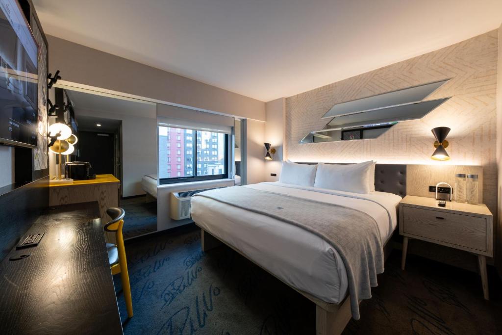 Postel nebo postele na pokoji v ubytování Pestana CR7 Times Square
