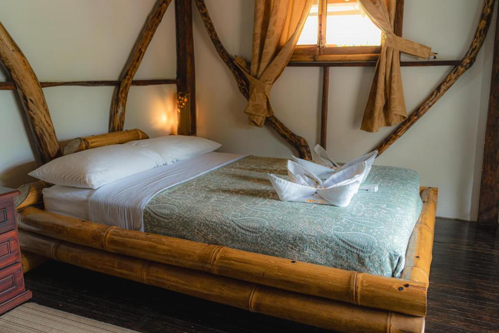 Postel nebo postele na pokoji v ubytování Finca Las Palmas Ecolodge