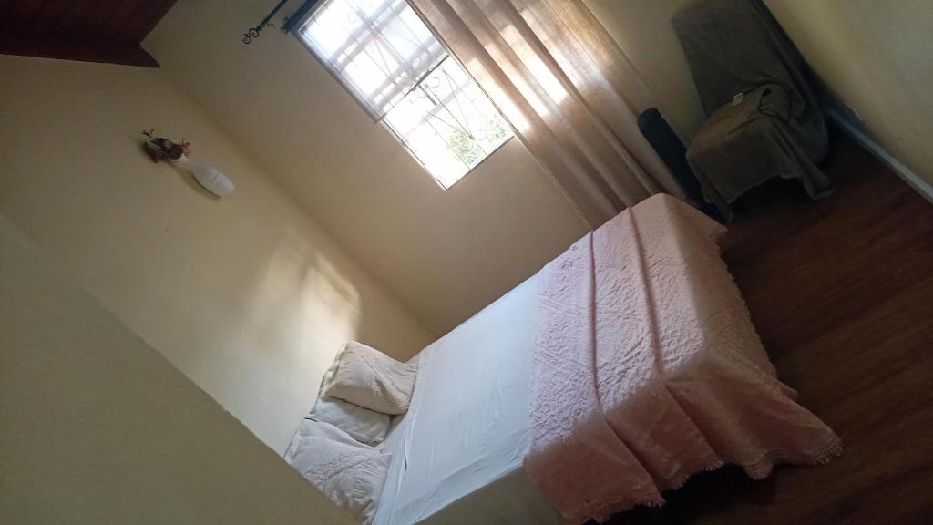 Postel nebo postele na pokoji v ubytování Chandler Homestay