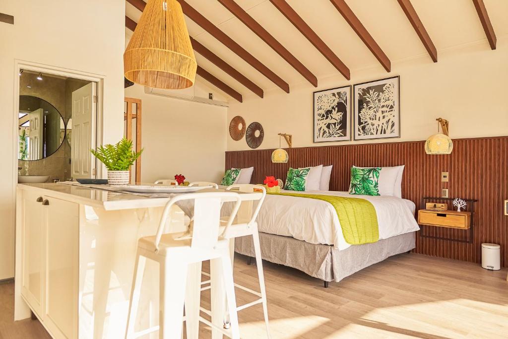 Postel nebo postele na pokoji v ubytování Tahai Loft Apart Hotel