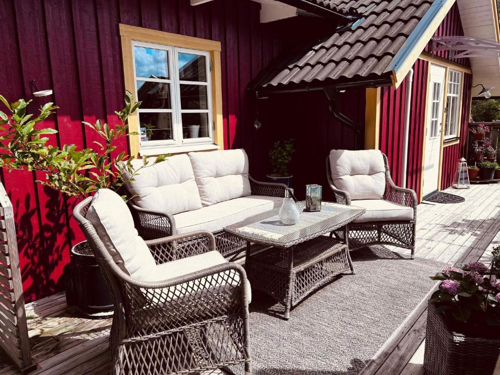 a group of chairs and a table on a patio at 4 star holiday home in UDDEVALLA in Uddevalla