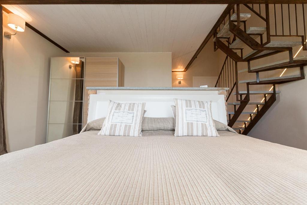 A bed or beds in a room at Locanda San Giorgio