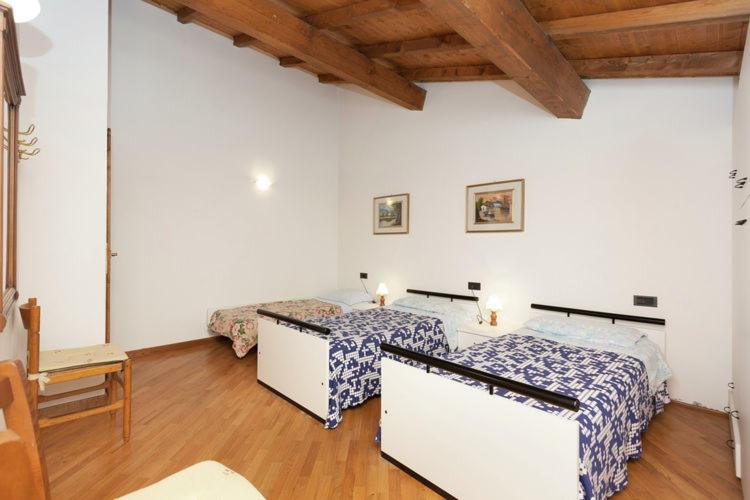 A bed or beds in a room at Podere Montestuccioli