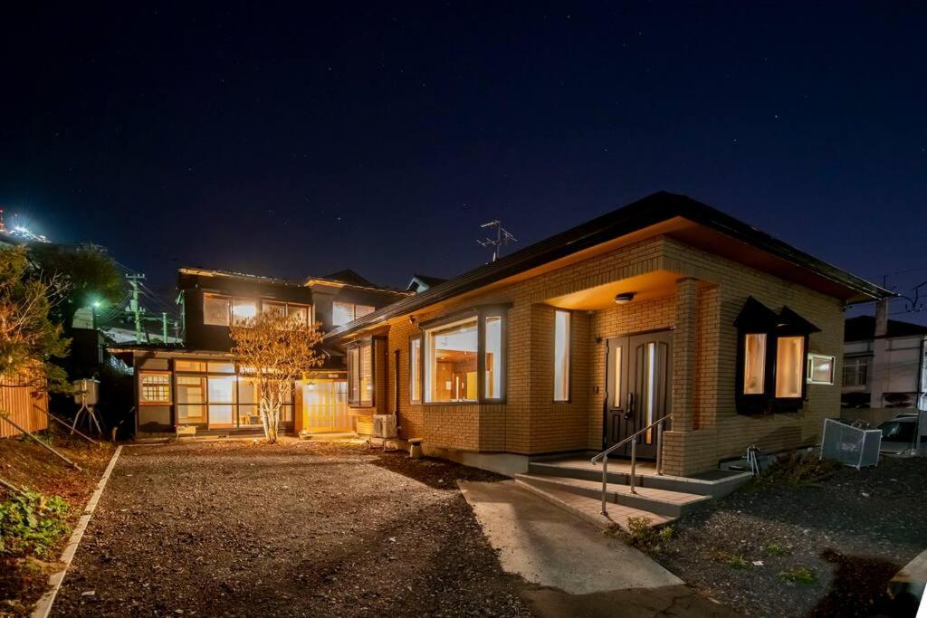 a house at night with the lights on at villa the rise hakodate in Hakodate