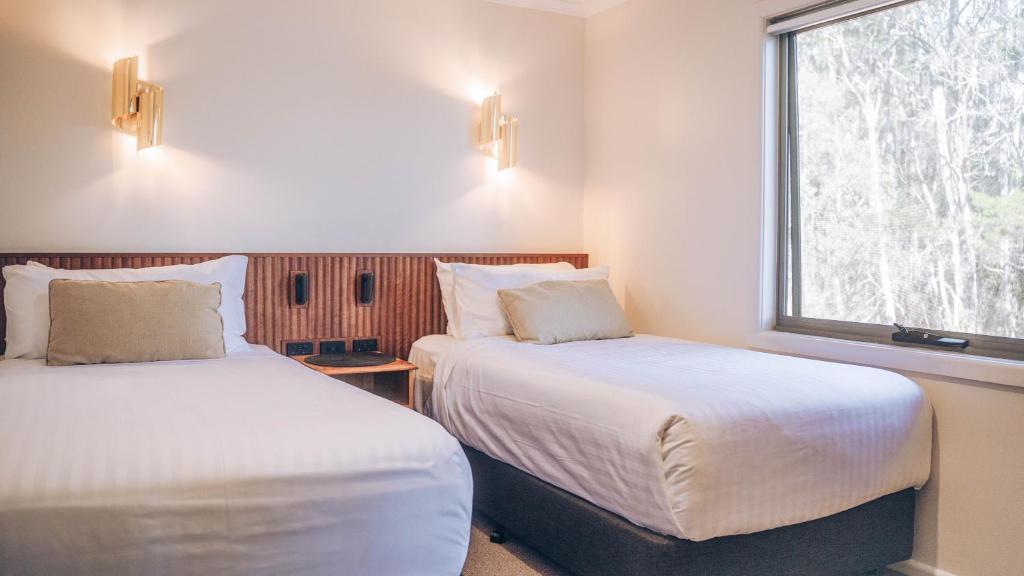 Postel nebo postele na pokoji v ubytování Risby Cove Boutique Hotel