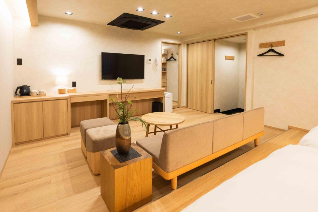 TV a/nebo společenská místnost v ubytování Hotel Paul House