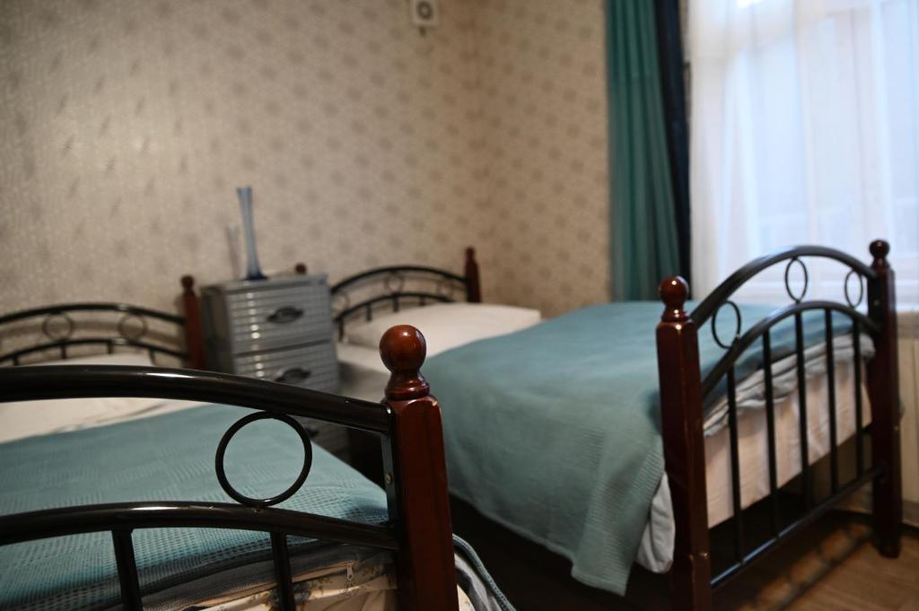 Postel nebo postele na pokoji v ubytování Babulya House