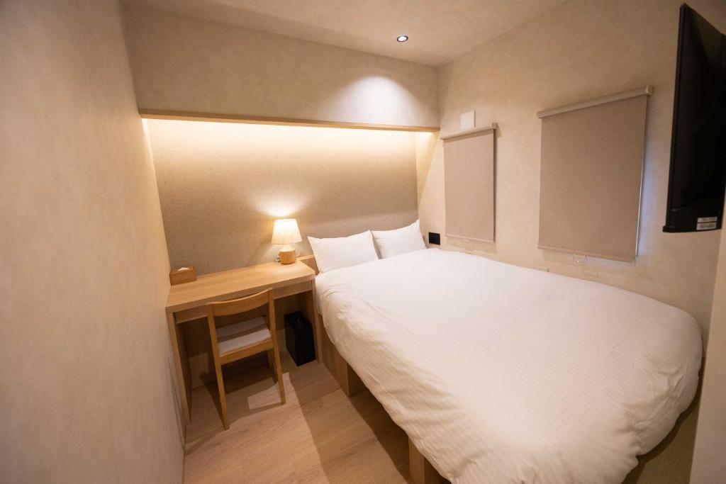 Postel nebo postele na pokoji v ubytování Hotel Paul House