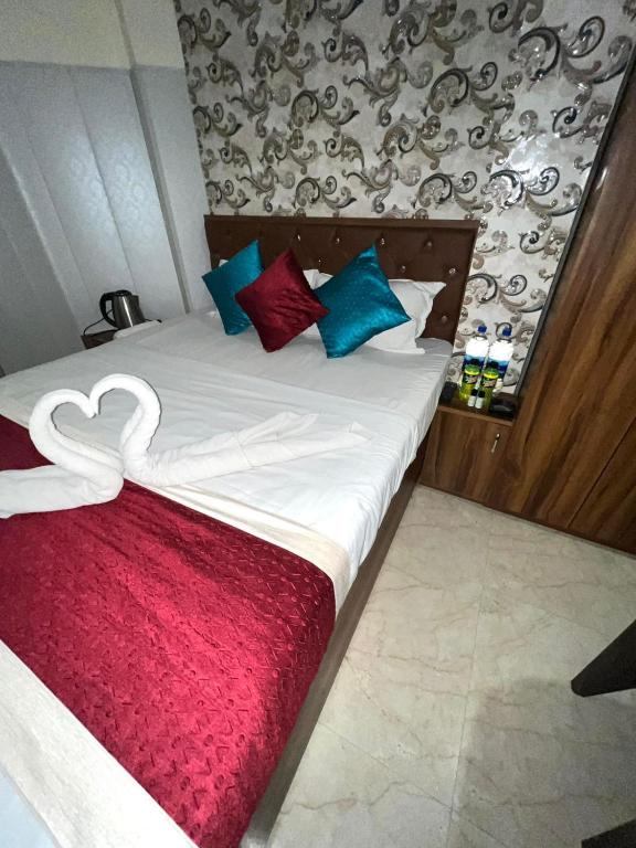 Postel nebo postele na pokoji v ubytování Hotel Rudra Paradise