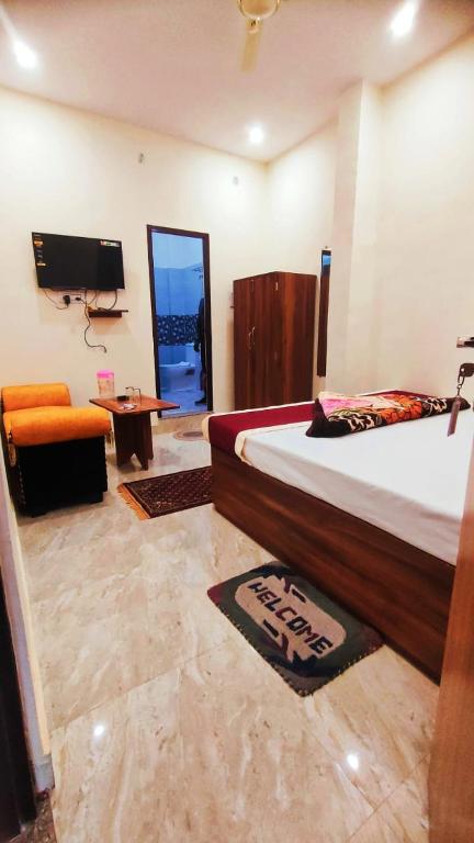 Postel nebo postele na pokoji v ubytování Hotel Rudra Paradise