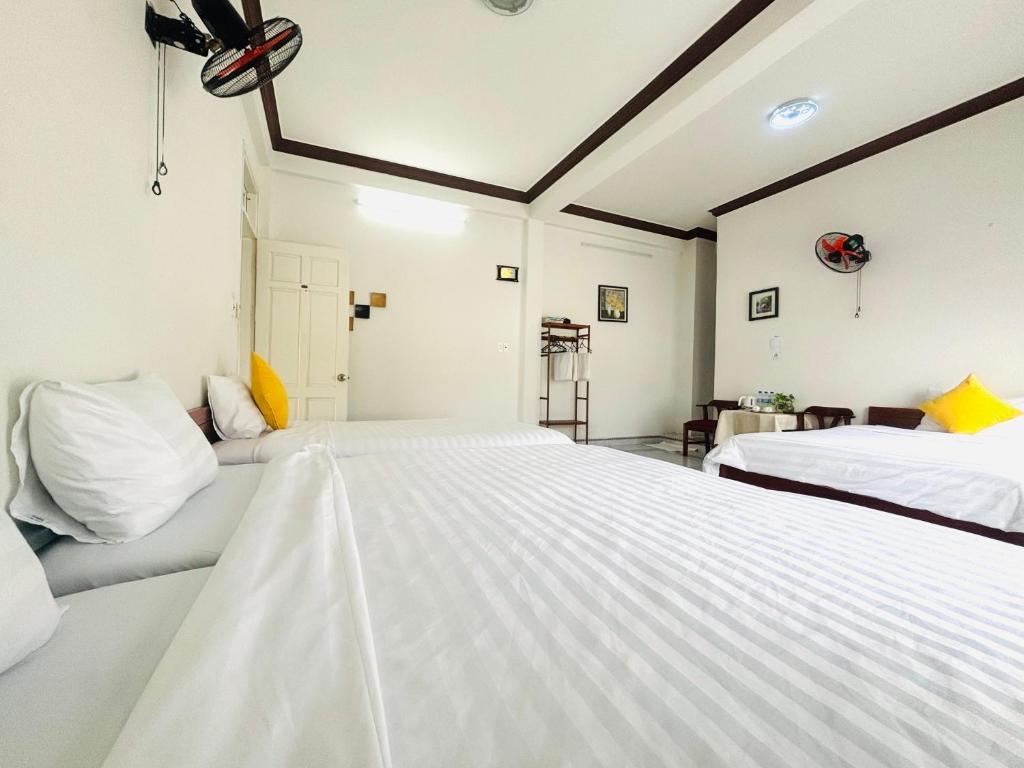 Giường trong phòng chung tại Good Morning Hoi An Homestay and Hostel