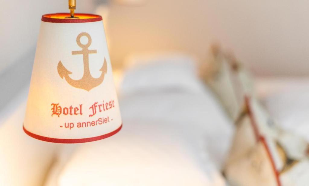 Postel nebo postele na pokoji v ubytování Hotel Friese