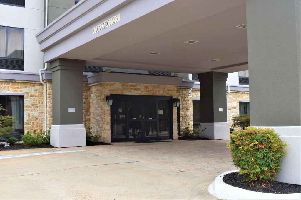 an entrance to a building with a glass door at Comfort Suites in Forrest City
