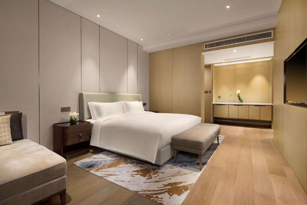 Postel nebo postele na pokoji v ubytování Wyndham Shanghai Pudong