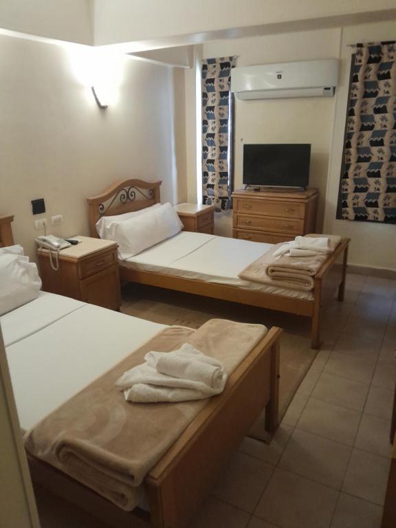 Postel nebo postele na pokoji v ubytování Applicators Hotel